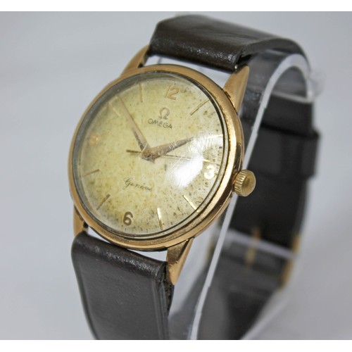 11 - An Omega 9ct gold wristwatch, circa 1960, case diam. 34mm, signed champagne dial, numerical and bato... 