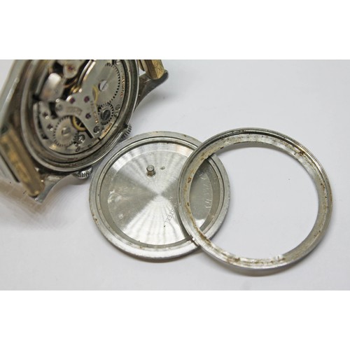 10 - A Paul Buhre stainless alarm wristwatch, circa 1950s, case diam. 30mm, champagne dial, 17 jewel manu... 