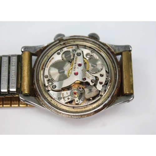 10 - A Paul Buhre stainless alarm wristwatch, circa 1950s, case diam. 30mm, champagne dial, 17 jewel manu... 