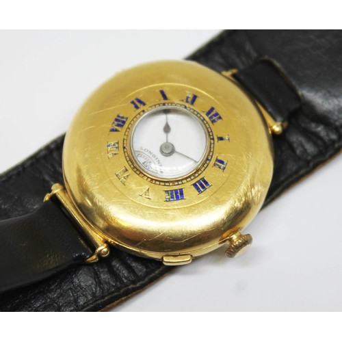 5 - A Longines 18ct gold half hunter trench type wristwatch, circa 1920s, diam. 34mm, signed white ename... 