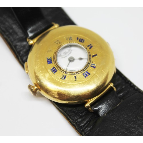 5 - A Longines 18ct gold half hunter trench type wristwatch, circa 1920s, diam. 34mm, signed white ename... 