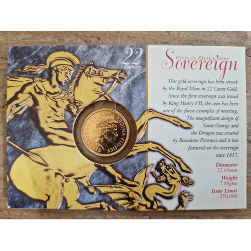 61 - Elizabeth II sovereign, 2000, in Royal Mint presentation card.