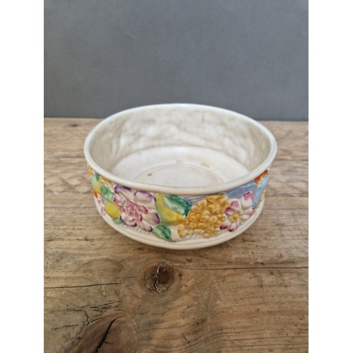 287 - A Clarice Cliff pottery bowl, decorated with birds and flowers, 20cm diameter.