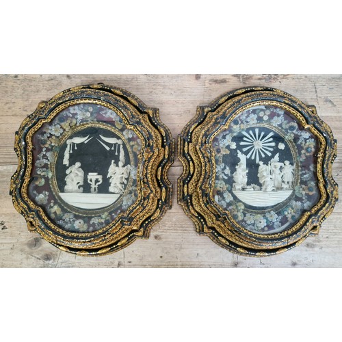 290 - A pair of Victorian black lacquer & gilt framed scenes in carved bone, both glazed, frame size of ea... 