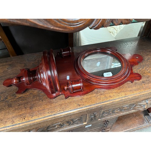 928 - A Victorian mahogany wall mirror with candle sconces.