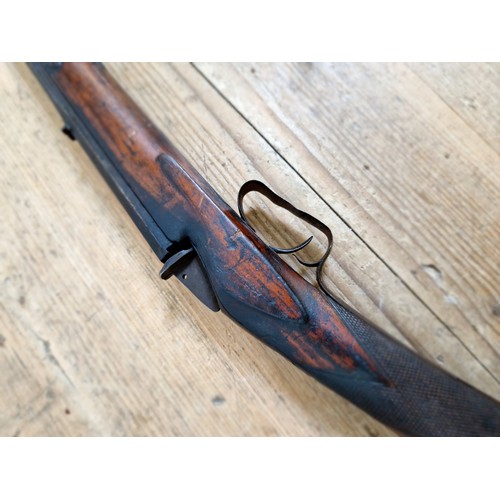 16 - An antique percussion rifle with curved walnut butt, 101cm long, barrel sealed. Note:- no in-house P... 