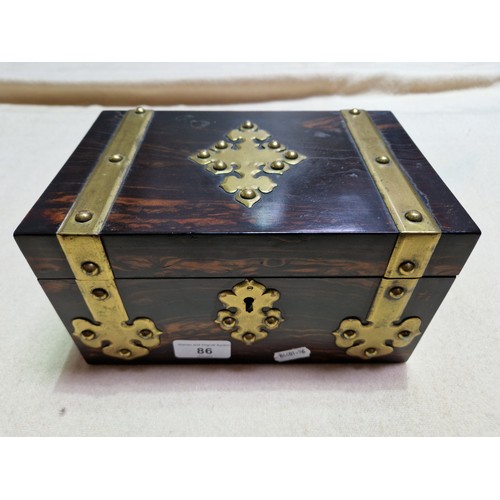 86 - A 19th century coromandel and brass bound jewellery box.