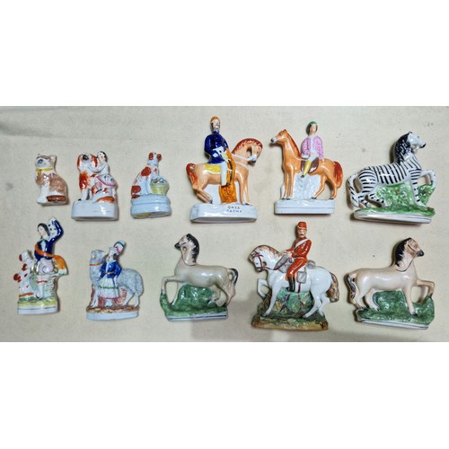 158 - A box of assorted Staffordshire pottery horses and dog figures.