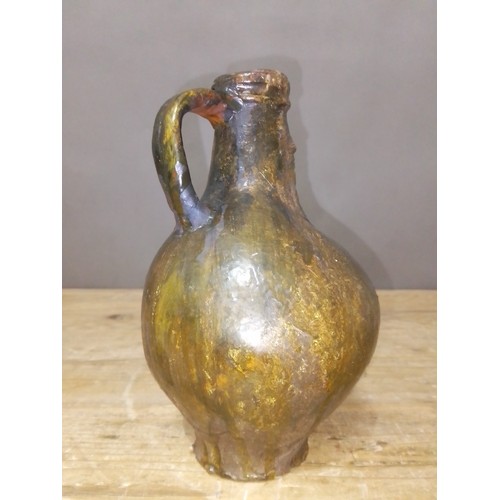 140 - A 17th century Bartmann jug, height 20.5cm.