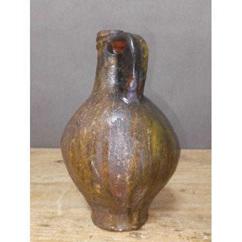 140 - A 17th century Bartmann jug, height 20.5cm.