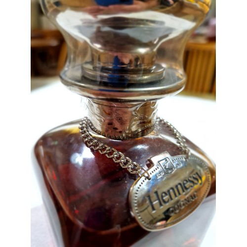 93 - A bottle of Hennessy Cognac, Decanter, 40% vol, 70cl, in a book style blue presentation case.