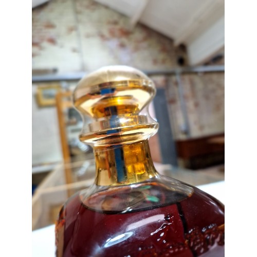 94 - A bottle of Hennessy Cognac, Decanter, 40% vol, 70cl, in a book style red presentation case.