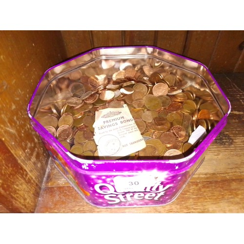 30 - A tub of coins.