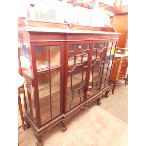 775 - A 1920s astragal glazed mahogany bookcase with gallery rail, gadrooned edge, claw and ball feet.