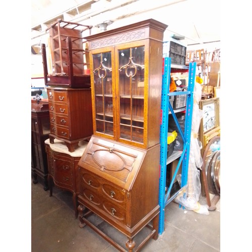 772 - An oak bureau bookcase.