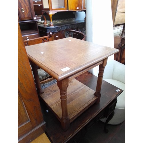 795 - A reproduction oak occasional table.