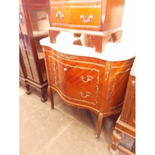 774 - A reproduction French metal mounted chest of drawers with marble top.