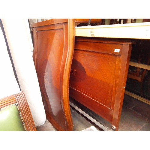 799 - An Edwardian inlaid mahogany double bedframe.