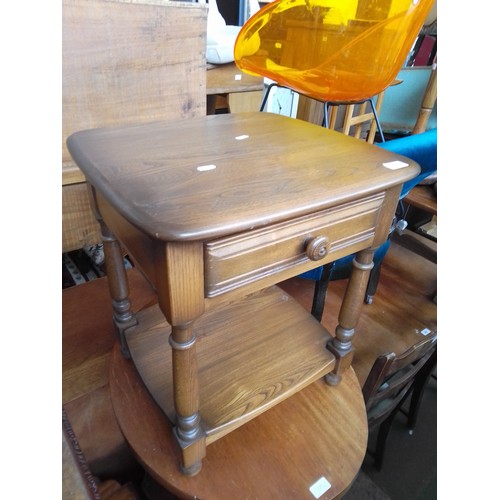 791 - An Ercol side table with drawer.