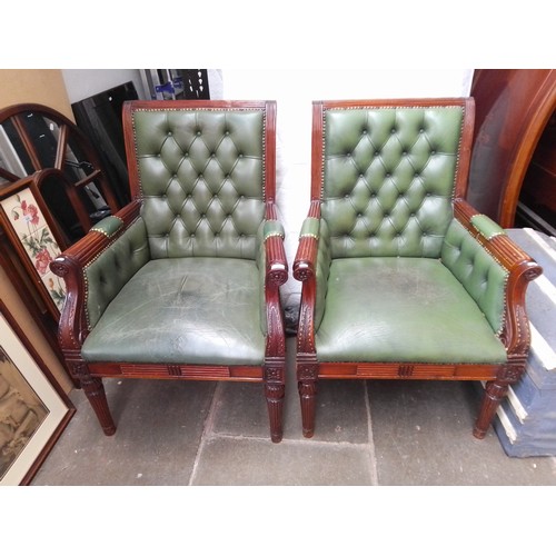 796 - A pair of Gillows style reproduction green leather armchairs.