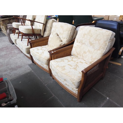 768 - An Ercol ash and beregere three piece suite.