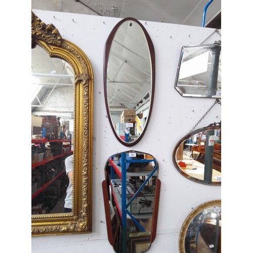 845 - A mid 20th century Clarke Eaton floating wall mirror and another mirror of a similar age.