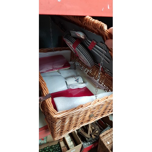 87 - A wicker picnic basket with contents.