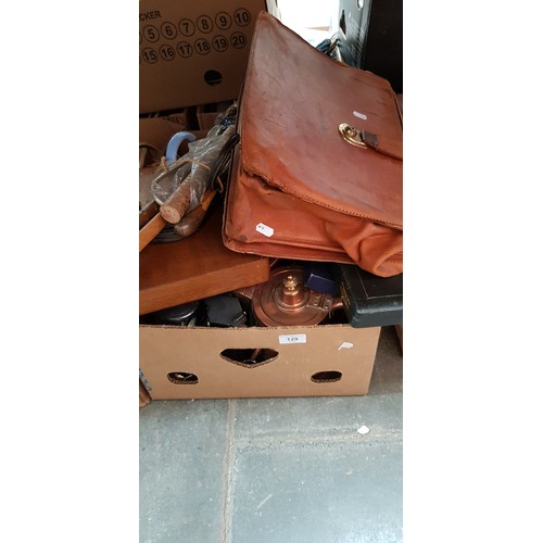 129 - A box of metal-ware, a vintage Gladstone type case, bundle of walking sticks, etc.