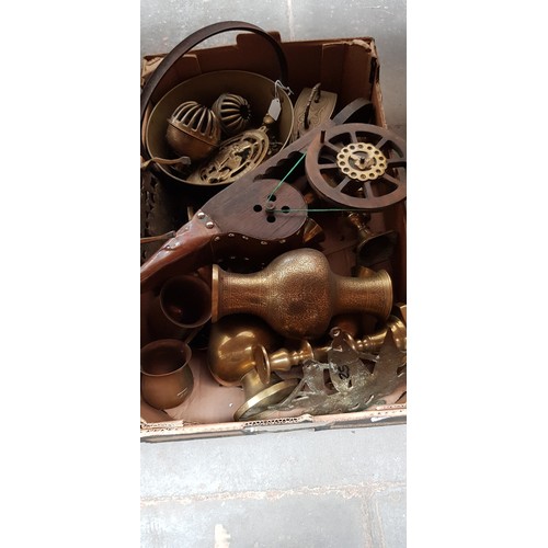 143 - A box of metal-ware, mainly brass.