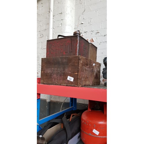 222 - Two vintage Shell oil cans in a vintage wooden box.