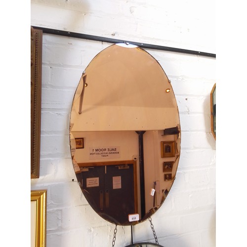 859 - A 1930s Art Deco peach glass wall mirror, scalloped edge, 45cm x 71cm.