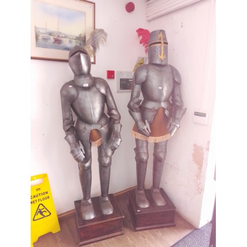 889 - Two reproduction suits of armour on display stands.