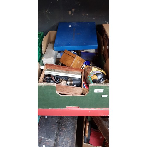 237 - A box of miscellaneous to include Royal Worcester plate, a student microscope, Royal memorabilia, Sw... 