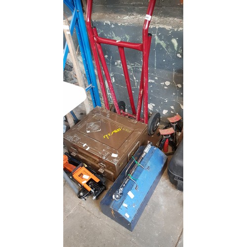 249 - A sack truck together with a brown ammunition box containing workshop vice, 2 vintage oil cans, vari... 