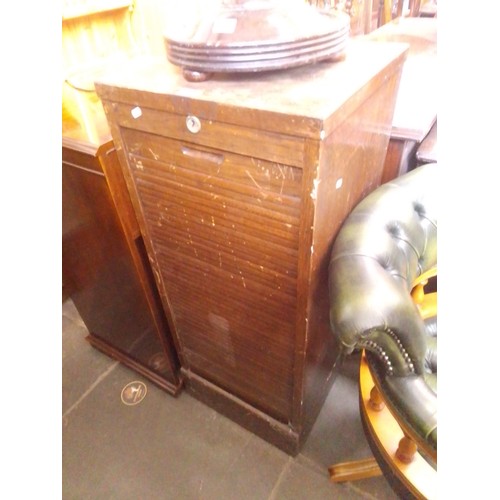 909 - A vintage tambour front oak filing cabinet.