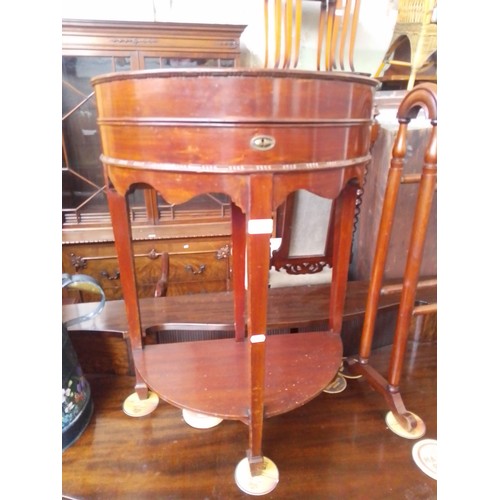 900 - A 1920s mahogany demi-lune fold top cutlery table.