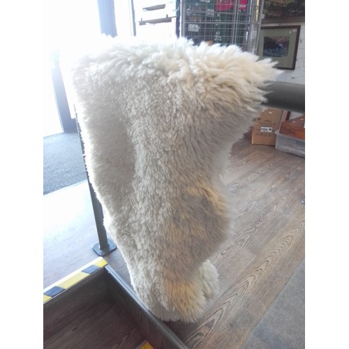 890 - A double pelt sheepskin rug.