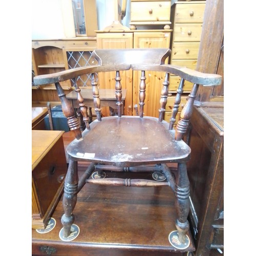 894 - A 19th century beech and elm captain's chair.