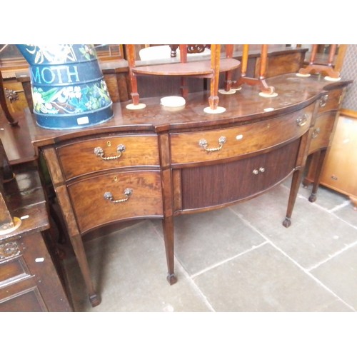 901 - A Regency serpentine front mahogany sideboard with tambour doors, width 183.5cm.