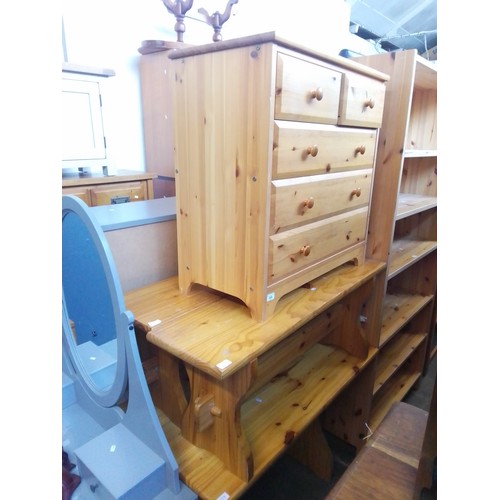 929 - A pine table with matching benches, together with a pine chest of drawers.