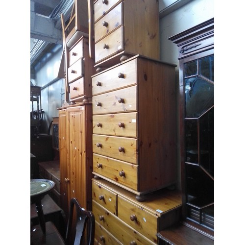 906 - Various items of pine furniture; a wardrobe, two chests of drawers, bedside cabinets, cheval mirror,... 