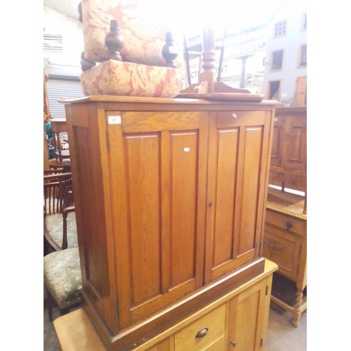 977 - An early 20th century oak shoe cabinet.