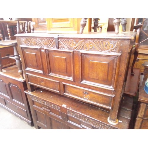 897 - A Georgian carved oak mule chest, length 115.5cm.