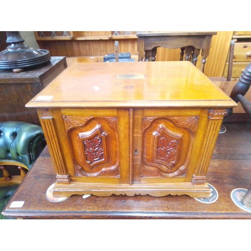 892 - A Victorian carved oak canteen containing 'Community' pattern plated cutlery, the canteen having a p... 