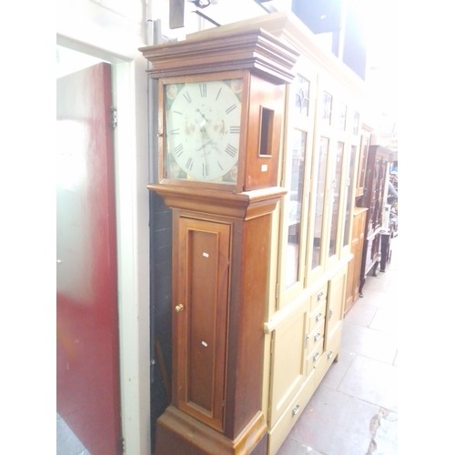 936 - A longcase clock with enamelled dial.