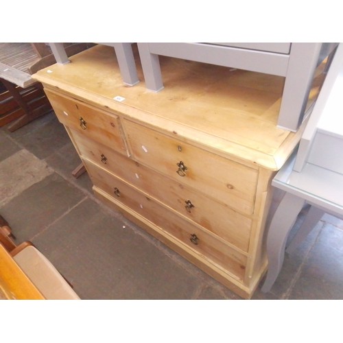 926 - A late Victorian pine chest of drawers with Gothic style handles, width 107cm.