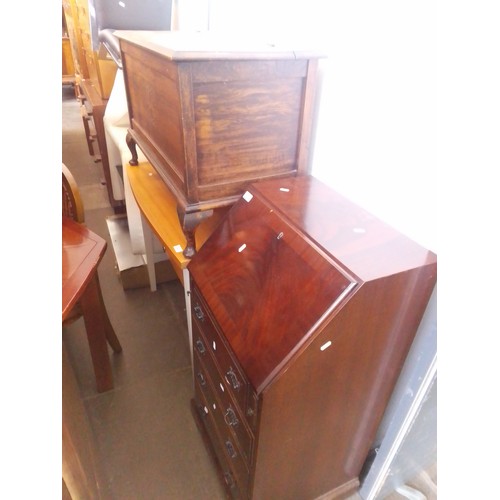 920 - Three pieces of furniture; an oak bedding box, a desk/side table and a mahogany bureau.