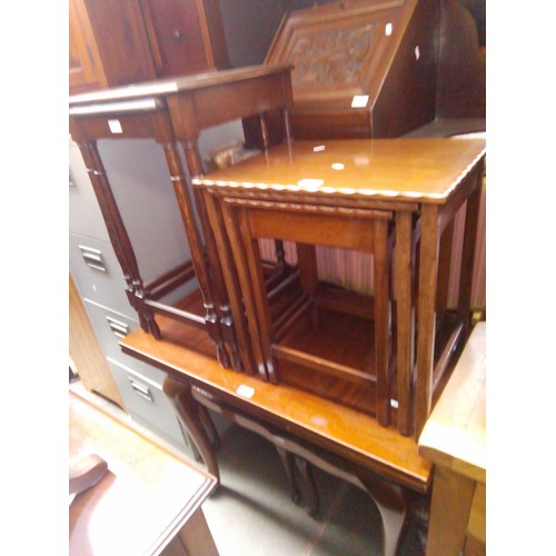 963 - Various items of furniture; a mahogany dining table, three nests of tables, a carved wood corner cab... 