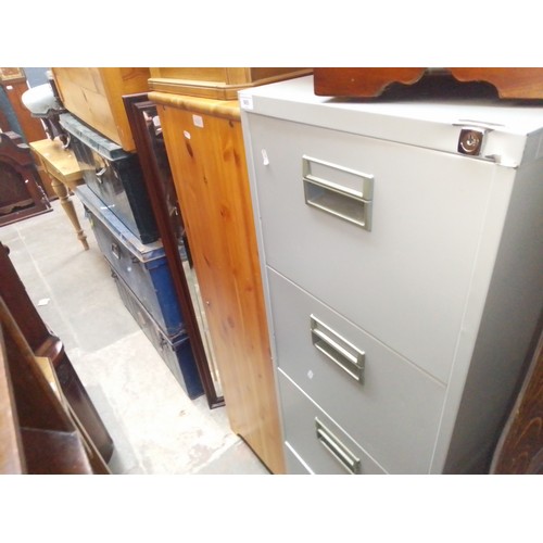 965 - Various items of furniture; a four drawer metal filing cabinet, pine chest of drawers, three metal s... 