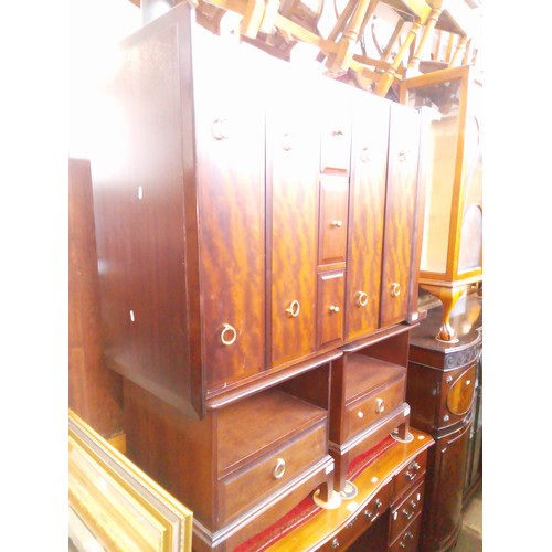 974 - A Stag mahogany tallboy chest of drawers together with a pair of Stag mahogany bedside cabinets.